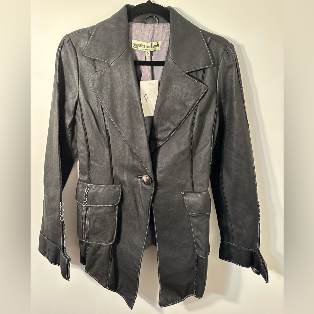 NWT black leather jacket with metal ring details